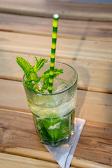 mojito cocktail on wooden background