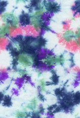 Absctract seamless tie-dye hand painted fabriс background with irregular floral spots