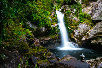 Obraz premium Beautiful waterfalls in the green nature, Wainui Falls, Abel Tasman, New Zealand.