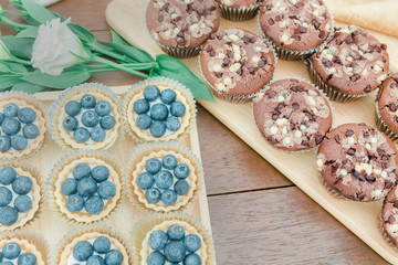 Chocolate cookies on wooden table background.