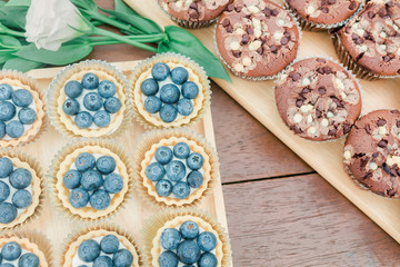 Chocolate cookies on wooden table background.