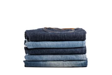 Stack of jeans isolated on white background.
