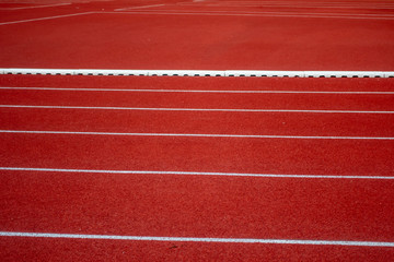 Red running track in stadium