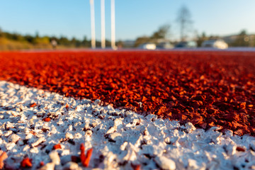 Red running track in stadium