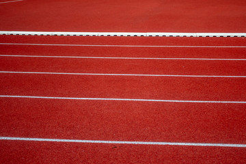 Red running track in stadium