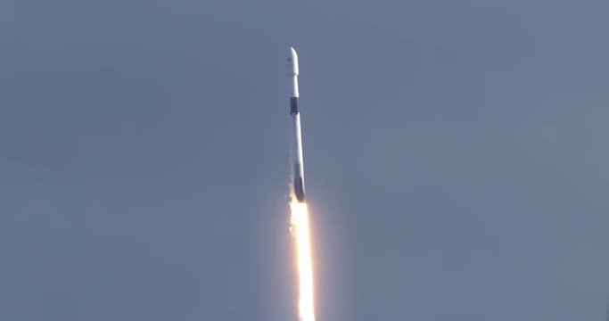 Space Rocket launches in daytime from Kennedy Space Center, 4K video at 120 fps slow motion.  With audio.
