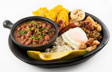 Traditional Colombian dish called Banda paisa: a plate typical of Medellin that includes meat, beans, egg and plantain © anamejia18