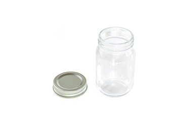 Empty jar of silver cap is open on a white background.