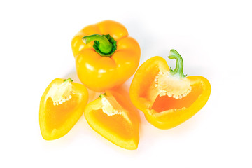 yellow bell pepper cut into pieces on white background, top view.