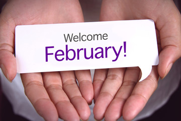 Hand showing welcome February.