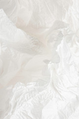 Obraz premium A crumpled piece of recyclable and biodegradable white tissue packaging paper.