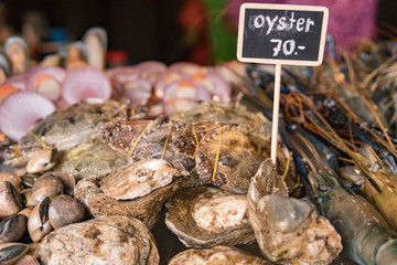 Nicely placed shrimp, mussels, seafood on ice in a bucket. Dining.