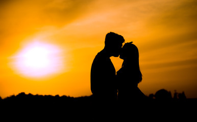 Fototapeta na wymiar silhouette of couple at sunset
