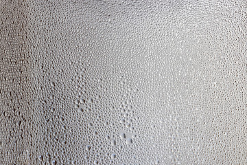 Sweat on the window. Drops of water on the glass.