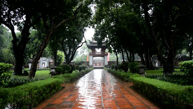Vietnamese temple entrance while raining (Wide shot)
