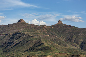 Landscape of two tits mountain at Lesotho country in Africa. Blue sky and white clouds in a midday....