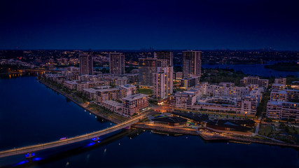 Aerial view of Rhodes, Sydney, during blue hour.
