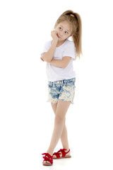 Little girl in a pure white t-shirt for advertising and shorts.