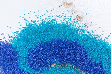 Layered colorful sand pattern. Marble style background. Blue and gold powder texture.