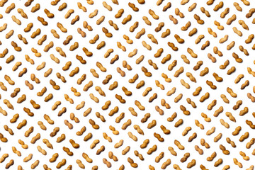 A collection of   Unpeeled peanuts   lie in straight rows along dioganals on an isolated white background. with clipping path.  Unpeeled peanuts pattern