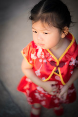 Girl in red Chinese dress.