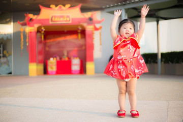 Girl in red Chinese dress.