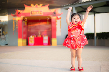 Girl in red Chinese dress.