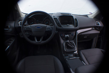 dashboard of a modern car with infotainment lcd panel fisheye