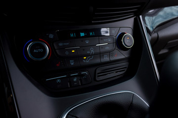 car radio and air conditioner control buttons