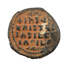Ancient copper or bronze byzantine coin isolated on white