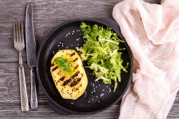 Vegetarian salad with grilled mango, fresh frisee and sesame