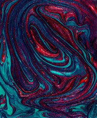 Vibrant green and purple marbling texture. Abstract colorful background. Liquid marble paint.