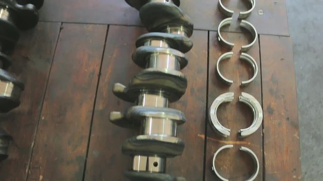Parts of a car engine in a car repair factory. Spare parts for car engine repair