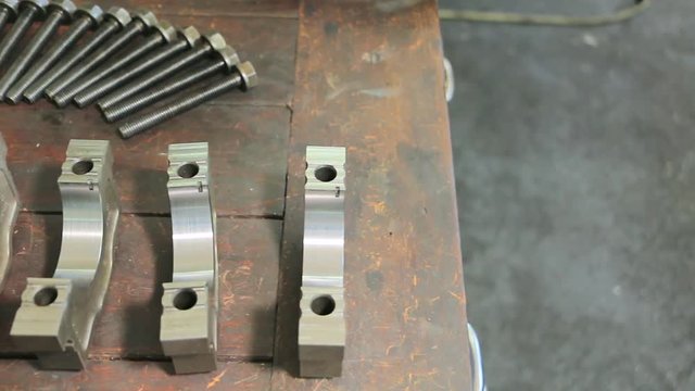Parts of a car engine in a car repair factory. Spare parts for car engine repair
