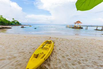 Yellow kayak boat on sea beach summer vacation concept