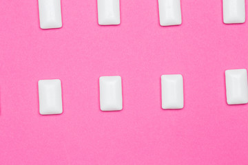 Chewing gum close up on a pink background