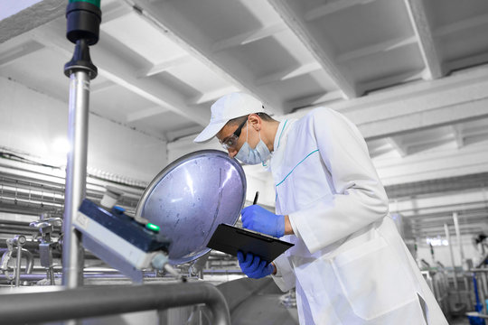 technologist controls the production of dairy products At the plant
