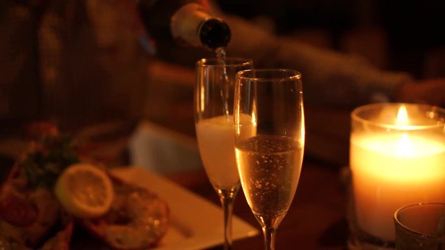 SLOWMO - Close Up - Anniversary - Pouring a glass of champagne at a luxury restaurant
