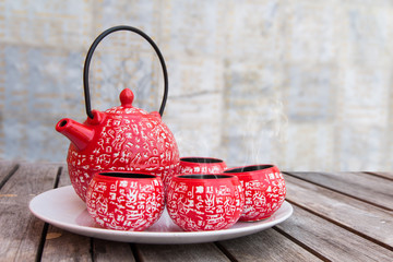 Tea brake set,Red cups of hot tea on the wood table