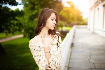 Brunette girl posing for photo at the park