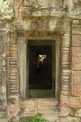 Stone temple doorway leading to fallen rocks
