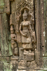 Statues of woman and husband in wall