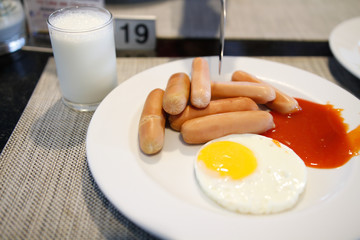 breakfast with fried eggs and milk