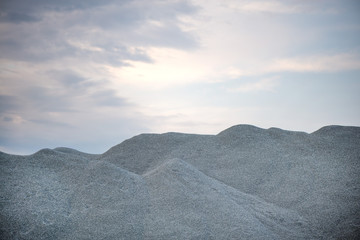 Large piles of construction sand and gravel used for asphalt production and building. Limestone...