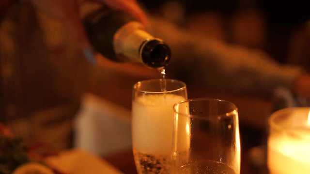 Close Up - Anniversary - Pouring a glass of champagne at a luxury restaurant