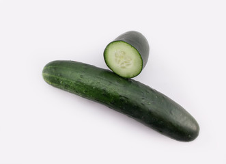 Fresh Cucumber Sliced on white background with water drops