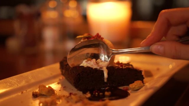 SLOWMO - Beautiful Blond Woman Eating Chocolate Brownie With Icecream At Luxury Restaurant