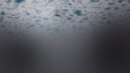 Black digital abstract background with wave particles, glow sparkles and space with depth of field. Particles form lines, surface and grid.