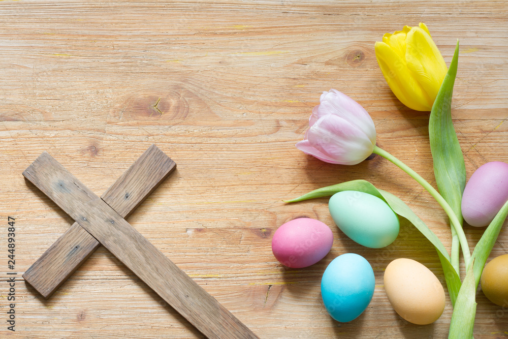 Wall mural easter eggs and cross on abstract wooden spring background