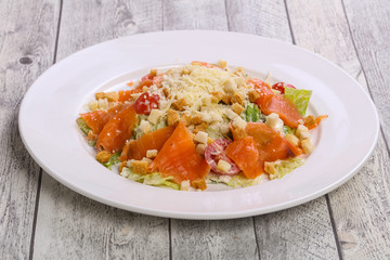 Caesar salad with salmon and parmesan